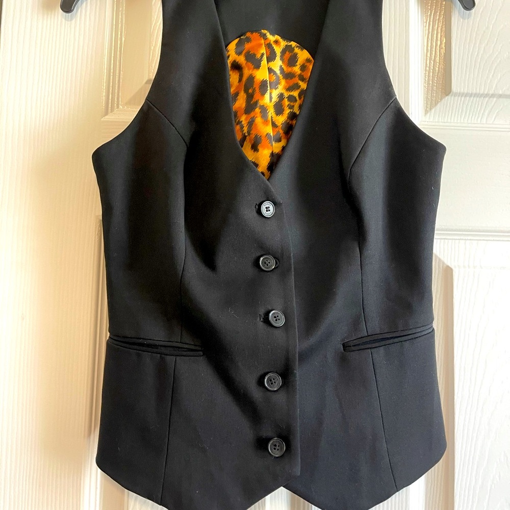 Black vest.